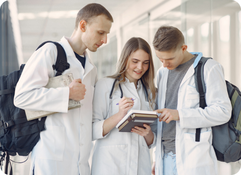Nurse working at a computer with a clipboard