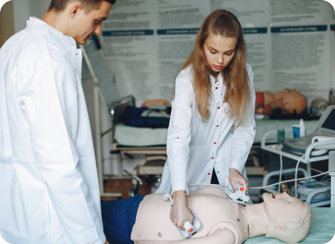 Nurse working at a computer with a clipboard